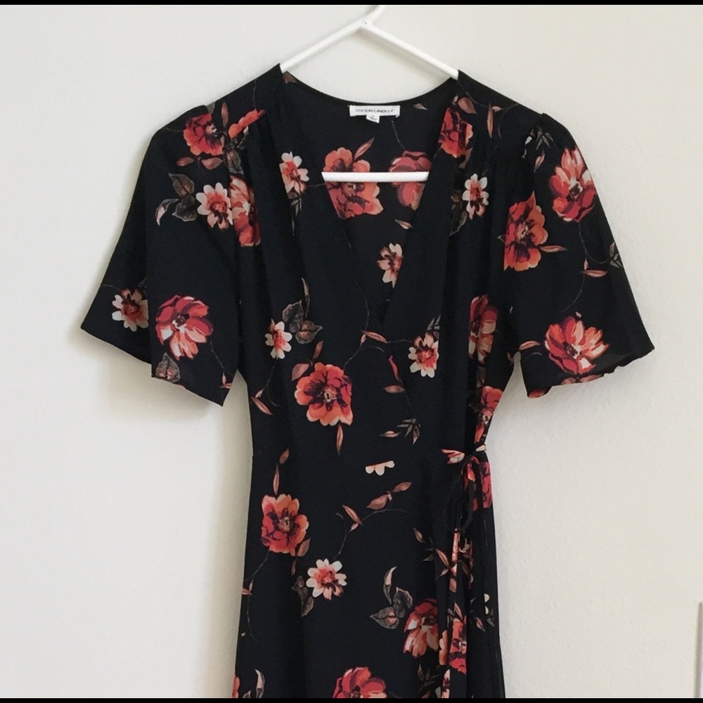 Long, black flowered wrap dress by Cotton Candy LA